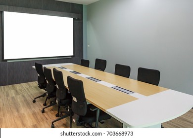 Blank Projection Screen In Meeting Room With Conference Table, Modern Meeting Room Interior Background