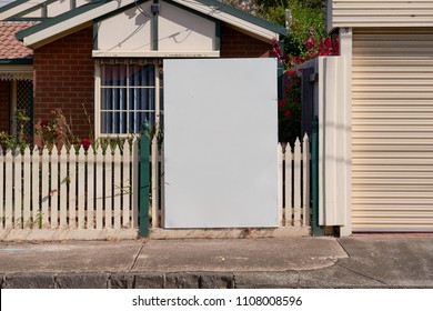 Blank Real Estate Sign Outside An Suburban Residential Property.