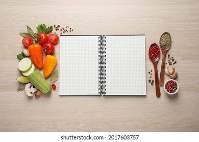 Blank Recipe Book And Different Ingredients On Wooden Table, Flat Lay. Space For Text