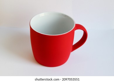 Blank red mug isolated on white background,mat tea or coffee cup,mock up with ceramic mug for hot drinks,empty gift print branding template,tankard for design,placement for logo. - Powered by Shutterstock