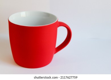 Blank red mug isolated on white background,mat tea or coffee cup,mock up with ceramic mug for hot drinks,empty gift print branding template,tankard for design,placement for logo. - Powered by Shutterstock