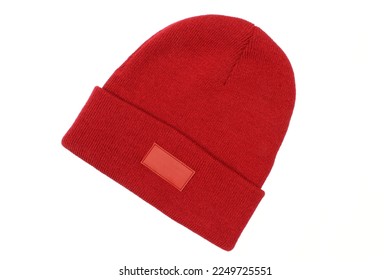 Blank red winter hat for men with blank label template isolated on white background. Classic woolen beanie cap