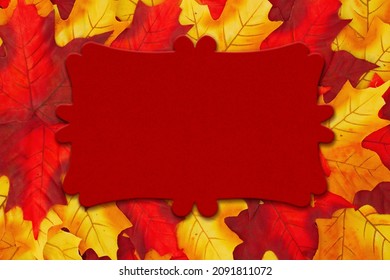 Blank Red Wood Sign On Red And Yellow Autumn Leaves For You Holiday Or Fall Message