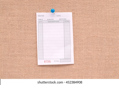 Blank Restaurant Receipt Hanging On Canvas Board Background