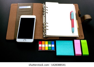 Blank Ring Binder Planner With Index Tabs, Mobile Phone And Note Pads Use For Time Management In Personal Or Business.