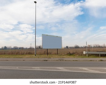 Blank Road Billboard For Advertising.
No People Are Visible, Shot Is Taken In Daylight.