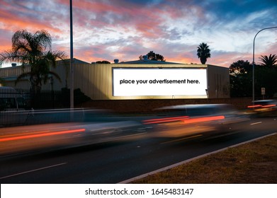 Blank Roadside Advertising Billboard With Traffic