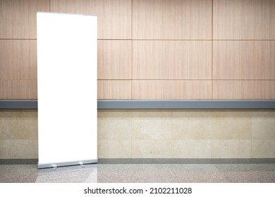 Blank roll up stand banner. Blank mockup for presentation isolated on wall background in hospital, hotel, airport. - Shutterstock ID 2102211028