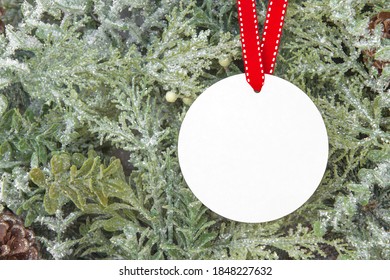 Blank Round Christmas Ornament Mockup Over Christmas Tree Background