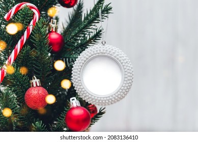 Blank Round Christmas Ornament Mockup On Christmas Tree. Holiday Festive Concept, Christmas Mock Up. Copy Space.