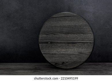 Blank Round Wood Sign With Copy Space Stand On Black Wooden Table. Simple Mockup Door Circle Sign.