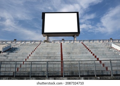 Blank Scoreboard With Empty Seating Stand And Blue Sky Background