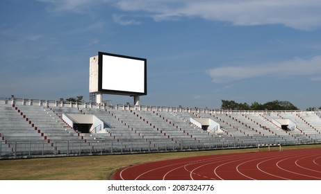 Blank Scoreboard With Empty Seating Stand And Blue Sky Background