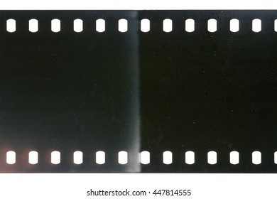 Blank scratched noisy gray filmstrip isolated on white background