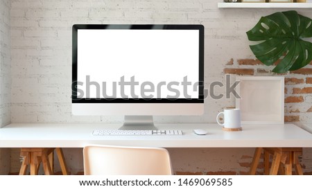 Blank screen desktop computer in minimal office room with decorations and copy space  Foto d'archivio © 