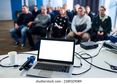 Blank Screen Laptop Computer With Blurred People On A Background