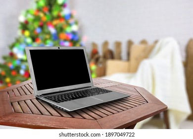 Blank Screen Laptop On Christmas Background. Happy Hour Party Online