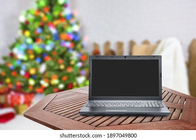 Blank Screen Laptop On Christmas Background. Happy Hour Party Online