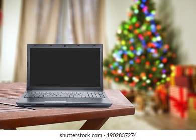 Blank Screen Laptop On Christmas Background. Happy Hour Party Online