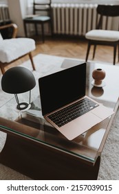 Blank Screen Laptop On Coffee Table. Home Office Desk Table Workspace. Copy Space Mockup Blog, Website Template. Blogger, Outsourcing Work Concept