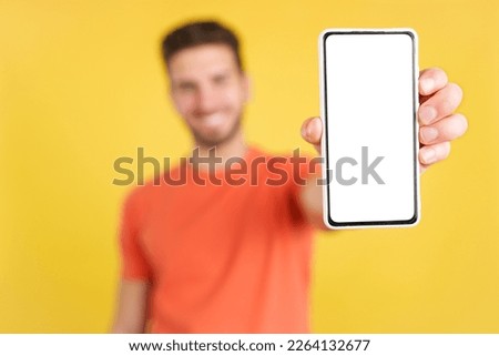 Blank screen of the mobile held by a caucasian man