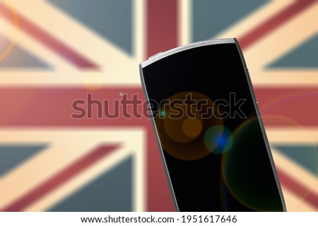 Blank screen on the smartphone and blurred Australian flag on the background screen.