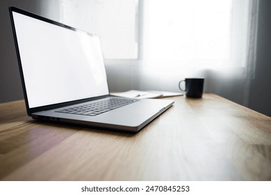 Blank screen open laptop computer on wooden table, mockup laptop. - Powered by Shutterstock