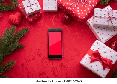 Blank Screen Smart Phone, Cell Phone, Tablet With Gift Box Frame On Red Background, Valentines Day Celebration Background.