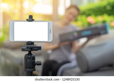 Blank screen Smart Phone on tripod shooting owner business woman work at home.E-Commerce online shopping social network entrepreneur concept.  - Shutterstock ID 1248925150