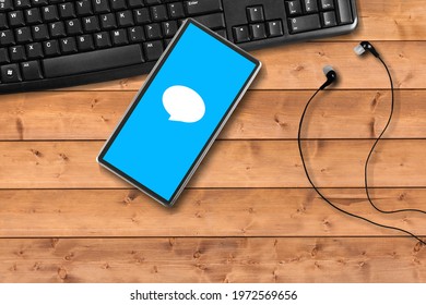 Blank screen smartphone on the computer keyboard