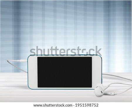 Blank screen view on the smartphone with headphones