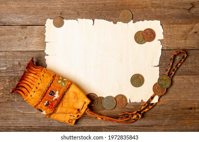 Blank Sheet Of Yellowed Old Papyrus Blank For Treasure Map, Antique Wallet With Several Copper Coins