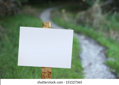 A Blank Sign Along A Hiking Trail. 