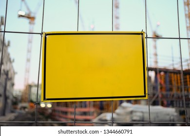 Blank Sign Hanging On Fence At Construction Site - Empty Sign Mockup