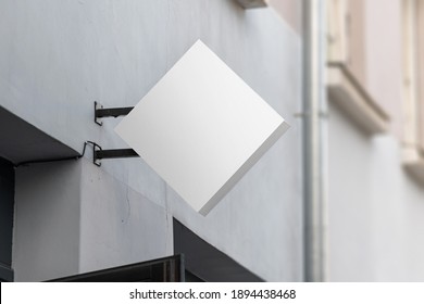 Blank Sign Mockup In The Urban Environment, On The Facade, Empty Space To Display Your Store Sign Or Logo