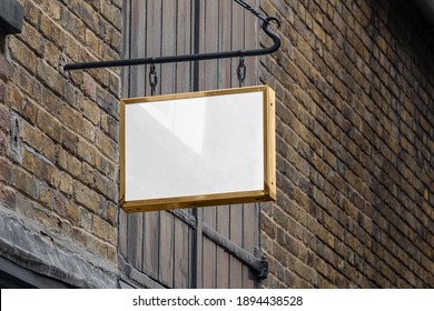 Blank Sign Mockup In The Urban Environment, On The Facade, Empty Space To Display Your Store Sign Or Logo