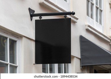 Blank Sign Mockup In The Urban Environment, On The Facade, Empty Space To Display Your Store Sign Or Logo