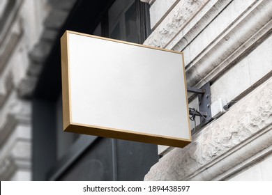 Blank Sign Mockup In The Urban Environment, On The Facade, Empty Space To Display Your Store Sign Or Logo