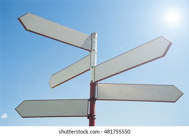 Blank Sign Post Against Blue Sky