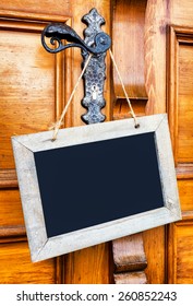 Blank Sign At A Wooden Door