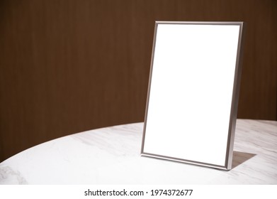 Blank Silver Photo Frame On The Desk