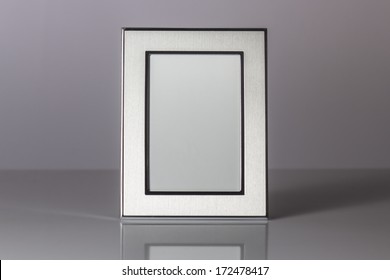 Blank Silver Picture Frame At The Desk