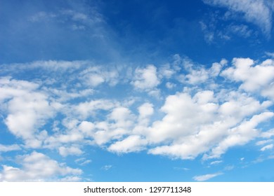 Blank sky surface with small clouds