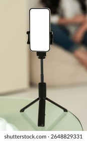 Blank smartphone tripod setup for content creation. Device is isolated for mockup or presentation use in digital projects.