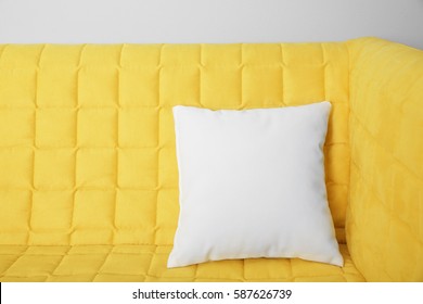 Blank Soft Pillow On Cozy Couch