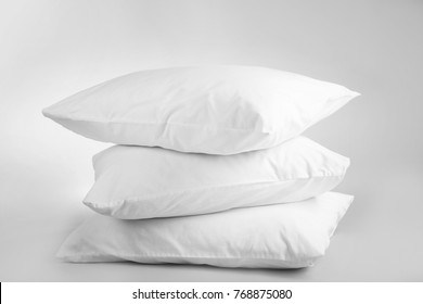 Blank soft pillows on light background