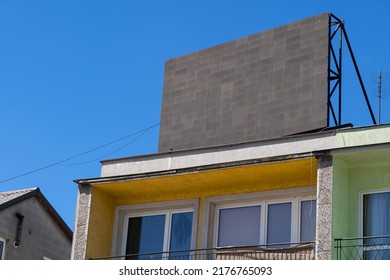 Blank Space For A Billboard Advertising On Apartment Building Roof.