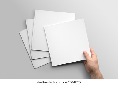 Blank square photorealistic brochure mockup on light grey background.  - Shutterstock ID 670958239