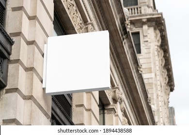 Blank Square Sign Mockup In The Urban Environment, On The Facade, Empty Space To Display Your Store Sign Or Logo