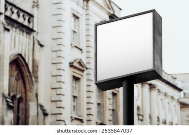 Blank square signpost in urban setting. Empty signpost for advertising. Signpost stands tall in city. Perfect for marketing. Blank signpost ready for content. Blank square street sign in city. - Powered by Shutterstock